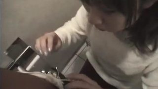 Nasty natural Asian teen giving fine blowjob in a public toilet